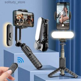 Stabilisateurs Trépied de bâton de selfie stabilisateur de joint universel avec lumière de remplissage et Bluetooth sans fil adapté au téléphone portable iPhone Q240320