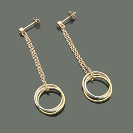 Pendientes largos entrelazados de tres anillos colgantes de un solo diamante de moda de acero inoxidable para parejas pendientes de tres anillos de tres colores