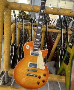 Standaard elektrische gitaar, oranje honinggradiënt, helder licht, zilveren accessoires en stemapparaat, verkrijgbaar in bliksempakket