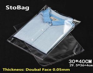 Stobag 100 stcs 3040 cm transparante zelfklevende plastic opp hersluitbare poly cellofaan kleding zakken Clear Packing Gift Bag y12021587000
