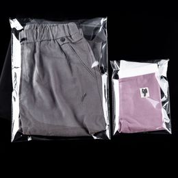 Stobag 100 stcs Big Size 7wires Dikke plastic zelfklevende tas reiskleding opslag transparante huisstofbestendige verpakking
