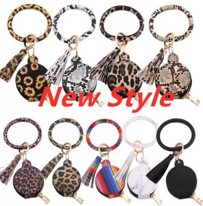 Stock coloré PU cuir glands Bracelets porte-clés bracelet tournesol léopard écouteurs sacs maquillage sac avec miroir porte-clés têtes