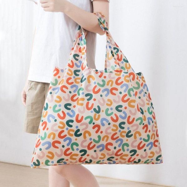 Sacs de rangement Sac à provisions pliable portable Sac d'épicerie en nylon réutilisable Sac lavable de grande capacité pliable avec pochette Main de fleur mignonne