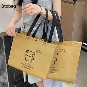 Sacs de rangement Stobag 10pcs Toture non tissés Tote Shopping Eco tissu Femme Réutilisable Sachets portables Logo personnalisé (frais supplémentaires)