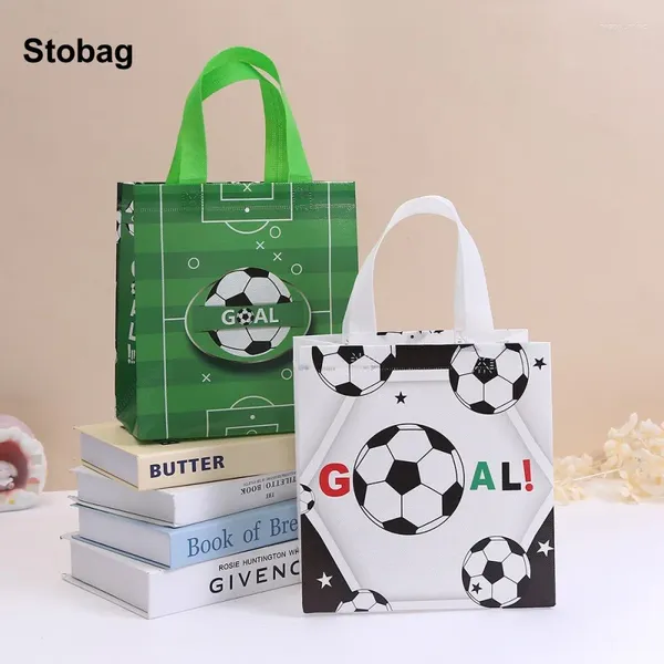 Bolsas de almacenamiento stobag 12pcs bolso no tejido bolso fútbol baby tela tela regalos para niños favores de fiesta reutilizables de cumpleaños