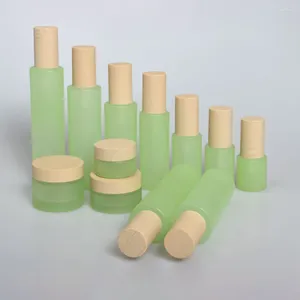 Bouteilles de rangement 1 once de soin de soin de soin en verre masque en verre Jar 30g rechargement vert givré vide avec capuchon de grain de bois