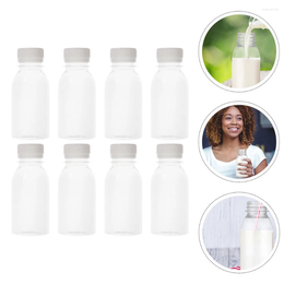 Bouteilles de rangement 10 / 15pcs bouteille de jus en plastique vide vide boisson d'eau lait d'eau boisson avec bouchons pour le camping sportif monte