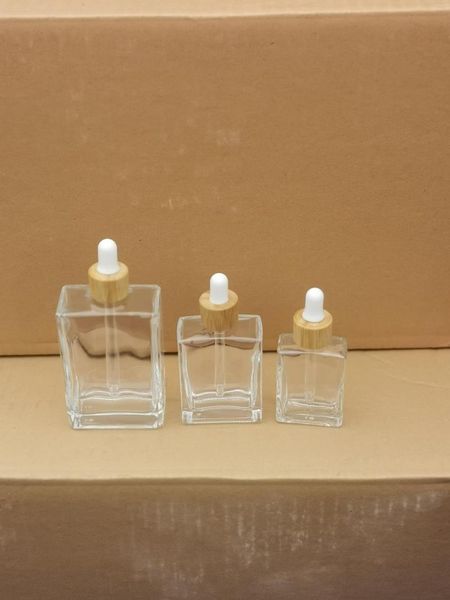 Bouteilles de stockage 100 ml 50 ml 30 ml bouteille en verre transparent carré avec couvercle compte-gouttes en bambou contenant d'huile essentielle flacon cosmétique