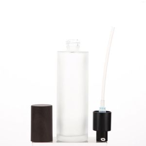 Bouteilles de rangement 100 ml 50pcs / lot Bouteille de pompe en verre avec tête de sérum et bonnet en plastique en bois en noir rond cosmétique en vente