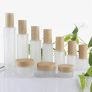 Bouteilles de rangement 100pcs / lot 4 oz de bouteille de lotion en verre de forme ronde pour le corps 120 ml de parfum rechargeable avec pompe à pulvérisation de brume