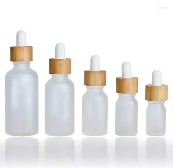 Botellas de almacenamiento 100pcs/lote 5ml 10ml 15ml 20ml 30ml 50ml Matte y transparente Botter de vidrio de vidrio de bambú Aceite ensalente SN737