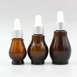 Bouteilles de rangement 100pcs / lot en gros 10 ml Amber Verre Verre Propulseur Small échantillon rechargeable pour les huiles eaaentiales
