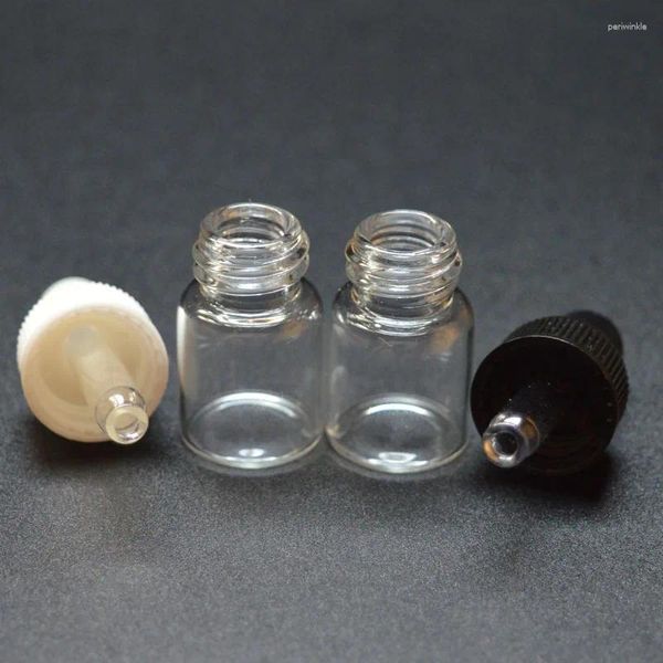 Bouteilles de rangement 100pcs petite bouteille en verre transparent 1 ml d'échantillon de flacon d'échantillon pour le parfum d'huile essentielle minuscule portable