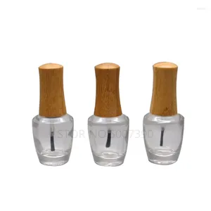 Bouteilles de rangement 10pcs 15 ml en verre transparent vide en bambou à capuchon de bouchon de bouchon de bouteille à ongles avec un gel de pinceau de couvercle