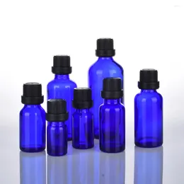 Botellas de almacenamiento 200 unids/lote 5/10/15/20/30/50/100 ML aceite esencial de vidrio azul cobalto con reductor de orificio Euro cuentagotas tapa a prueba de manipulaciones