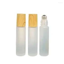 Opslagflessen 25 stks 5 ml 10 ml Mini Frost glas Essentiële oliemonster Navullabe Massage Steel Roller False houten deksel Parfumrol op