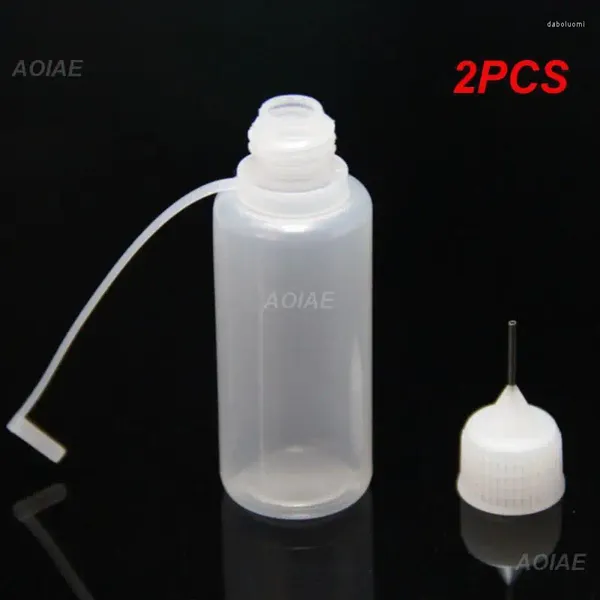 Bouteilles de rangement 2pcs JUI DE LIQUIDE PORTABLE AIGINE PULODIQUE AIGINE PROPOSIQUE PROFICANT POUR LIQUIDES 10-50 ML MULTIFONCTIONNEL