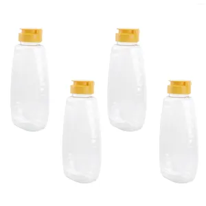 Bouteilles de rangement 4pcs Dispensateur de miel Récipient de bouteille de bouteille avec couvercle de capuchon pour boutiques fraîches Bocs en verre