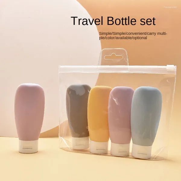 Botellas de almacenamiento 4 unids / set Juego de botellas de viaje 60 ml Botella recargable Loción de silicona suave Champú Contenedor Tubo de compresión Vacío al por mayor