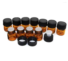 Bouteilles de rangement 500pcs / lot 1 ml Bouteille d'huile essentielle en verre ambre avec réducteur à orifice et capuchon de capuche 1/4 dram par DHL Wholesale