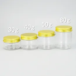 Bouteilles de rangement 50pcs 30g 40g 50g 80g Mini de voyage de voyage vide de voyage Vishs de crème avec les couvercles en aluminium doré Conteneurs transparents pour cosmétiques