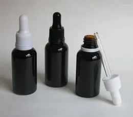 Bouteilles de rangement 50pcs 30 ml bouteille d'huile essentielle en verre noir vide avec sabot de gouttes évidents en plastique