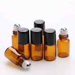 Botellas de almacenamiento 50 piezas/lote 1 ml 2 ml 3ml 5 ml de vilindros de muestra de perfume mini rodillo amar botella de vidrio esencial con tapa de plástico negro