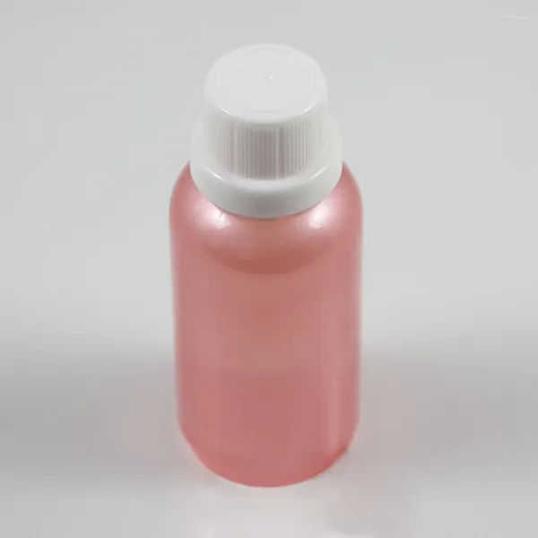 Bouteilles de stockage 50pcs en gros 1 once vide verre rose récipient d'huile essentielle avec bouchon à vis anti-effraction blanc bouteille de 30 ml
