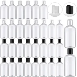 Bouteilles de rangement 5pcs 30 ml / 50 ml / 60 ml / 100 ml Plastique transparent vide avec capuchons à disque Répéteurs de compression rechargeables pour la crème de lotion de shampooing