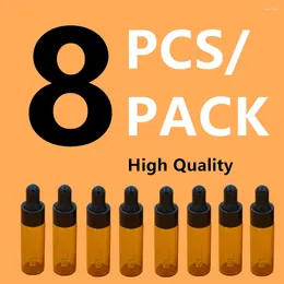 Bouteilles de rangement 8pcs / pack 5 ml Mini Amber Glass Propper bouteille pour huile essentielle avec plaquettes Cosmetic Vide Conteneurs