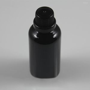 Bouteilles de stockage Bouteille en verre noir de haute qualité de 50 ml avec couvercle inviolable 50cc contenants d'huile essentielle vides à vendre