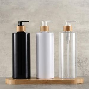 Bouteilles de stockage Huile capillaire biodégradable de haute qualité en gros Pompe vide en plastique transparent givré pour shampooing désinfectant 500 ml