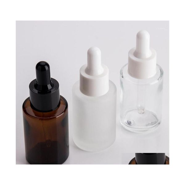 Bouteilles de stockage Bocaux 100pcs 30ml plat Shoder givré verre clair compte-gouttes avec couvercle blanc 1oz sérum ambre bouchon d'or goutte de livraison Dhepv