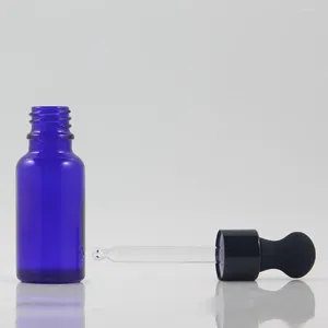Les bouteilles de rangement vendent un récipient en verre bleu vide avec une bouteille d'huile de coiffure de soins de la peau en aluminium en aluminium 20 ml