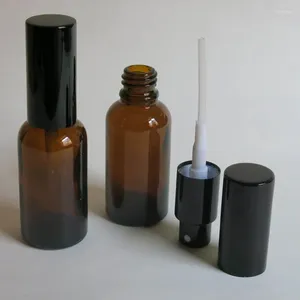 Botellas de almacenamiento al por mayor 100 pcs 30 ml de botella de vidrio ámbar con rociador de niebla esencial de fábrica de aceite de aceite