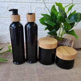 Bouteilles de rangement en gros ambre / noir givré / blanc / clean en plastique et pots crème bouteille de bouchon de bambou contenants de cosmétiques