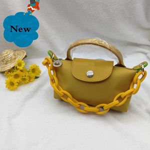 Almacena de bolsas de diseño de bolso pequeño barato Cadena al por mayor de la cadena para mujeres Mango de masa de masa a mano 2024 mini billeteras de manejo único diseñadores