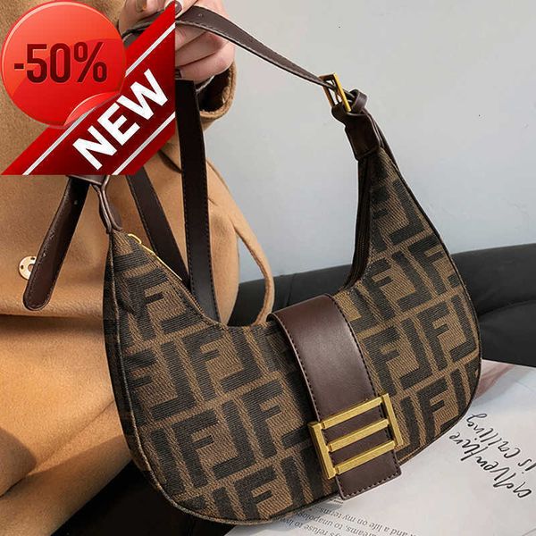 La tienda tiene un 80% de descuento en el bolso de la marca al por mayor para mujer 2023 nueva moda French Stick Armpit Shoulder Net Red Air Canvas Messenger