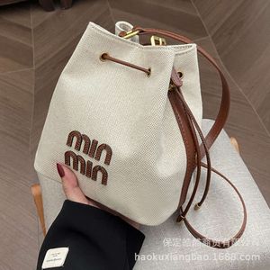 Magasins exportent des sacs à bandoulière de créateurs cette année, sac seau populaire pour femmes en 2024, nouveau sac à main en toile coréen haut de gamme et polyvalent