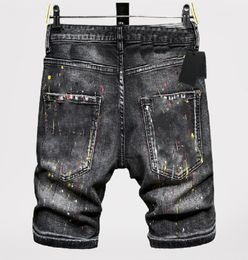 Jeans à jambe droite badge déchiré pour homme Jeans stretch noir Jeans de moto à coupe slim pour hommes Pantalon hip hop à empiècements Pantalon moyen en denim