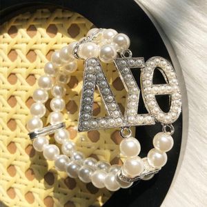 STRAND DST Dubbele laag Handgemaakte Retro Pearl Elastische Bracelet Women Sieraden Bruiloftgeschenk