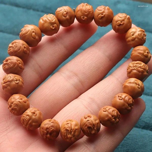 Strand Golden Sinke Head Peach Pit sculpté Artisanat Bracelet de perle légère de graines d'origine