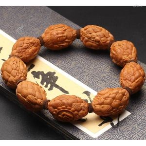 Bracelet à main en forme d'écrou sculpté à la main sur le trône du Lotus, produit en brin, pierre d'olive Hu, Guanyin avec certificat