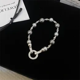 Colliers de bracelet de perle en verre gris de température vintage