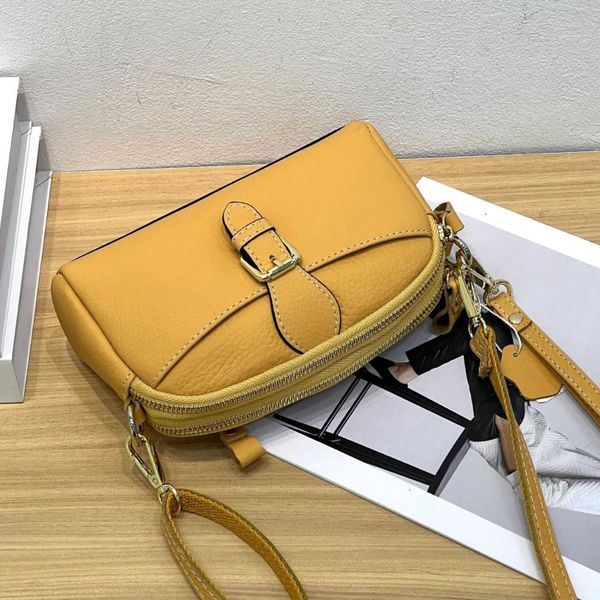 Streaming Live Top Layer Cowhide Womens Sac Single Bodage Crossbody Forme mignon et à la mode Shell Mobile Phone Produit