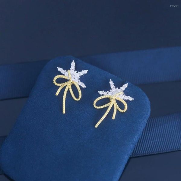 Boucles d'oreilles à clous pour femmes, ruban avec nœud flocon de neige, tempérament Simple, personnalité, mode exquise, vente 2024