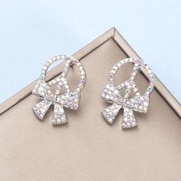 Boucles d'oreilles coréennes en alliage de mode incrusté de strass rétro logo de paix nœud papillon pour femmes produits tendance creux bijoux mignons pour filles