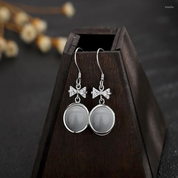 Pendientes de botón S925 Plata de ley Ronda Opal Zircon Mujeres Moda simple Arco Luz Lujo Venta al por mayor. 1