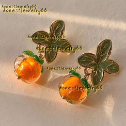 Stud Stud Pendientes Creativo Caqui Color Naranja Flor Hoja Para Mujeres Pendientes Joyería Pintura Vidrio Esmaltado Al Óleo Joyería De Tendencia Al Por Mayor 2024