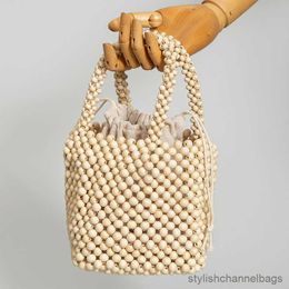 Sacs fourre-tout de haute qualité en bois sac à main femmes tissé à la main évider sac fourre-tout été plage vacances voyage sac 2023 nouveau